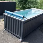 20-Fuß-Containerpool Anthrazit mit 75 m³/h Gegenstromanlage, Wärmepumpe & Heizung